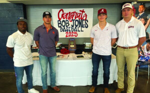 Four members of the Bob Jones baseball team signs for scholarships