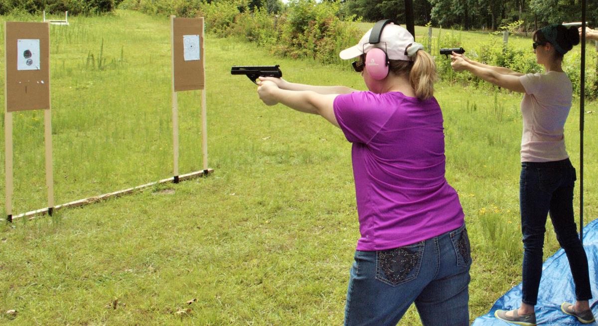 Students practice shooting during a class with Southern Belle Firearms Trai...